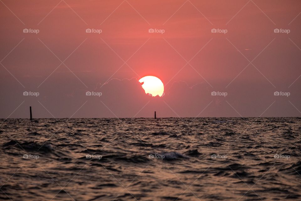 Big sunset into the sea at Thailand famous Bang Saen beach 