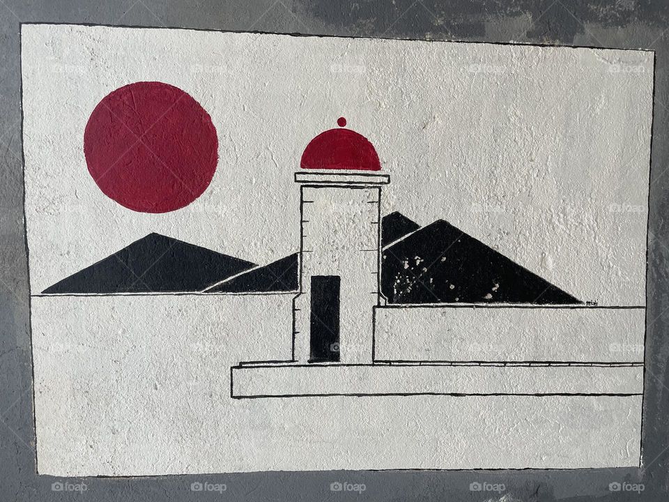A scenery on wall which shows sun mountain and lighthouse on sea