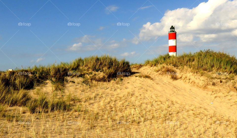 sand dune and lighthouse 