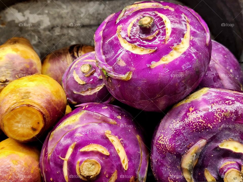 close up view of fresh purple rutabagas for sale in an Oregon market