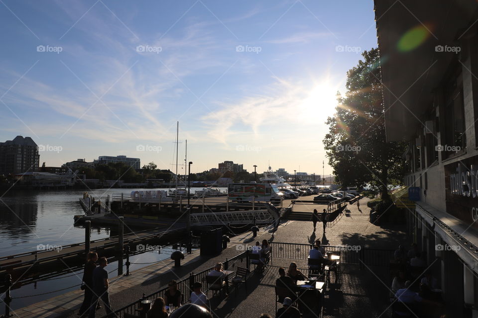 Life by the harbor on a late afternoon and sun casting shadows everywhere 