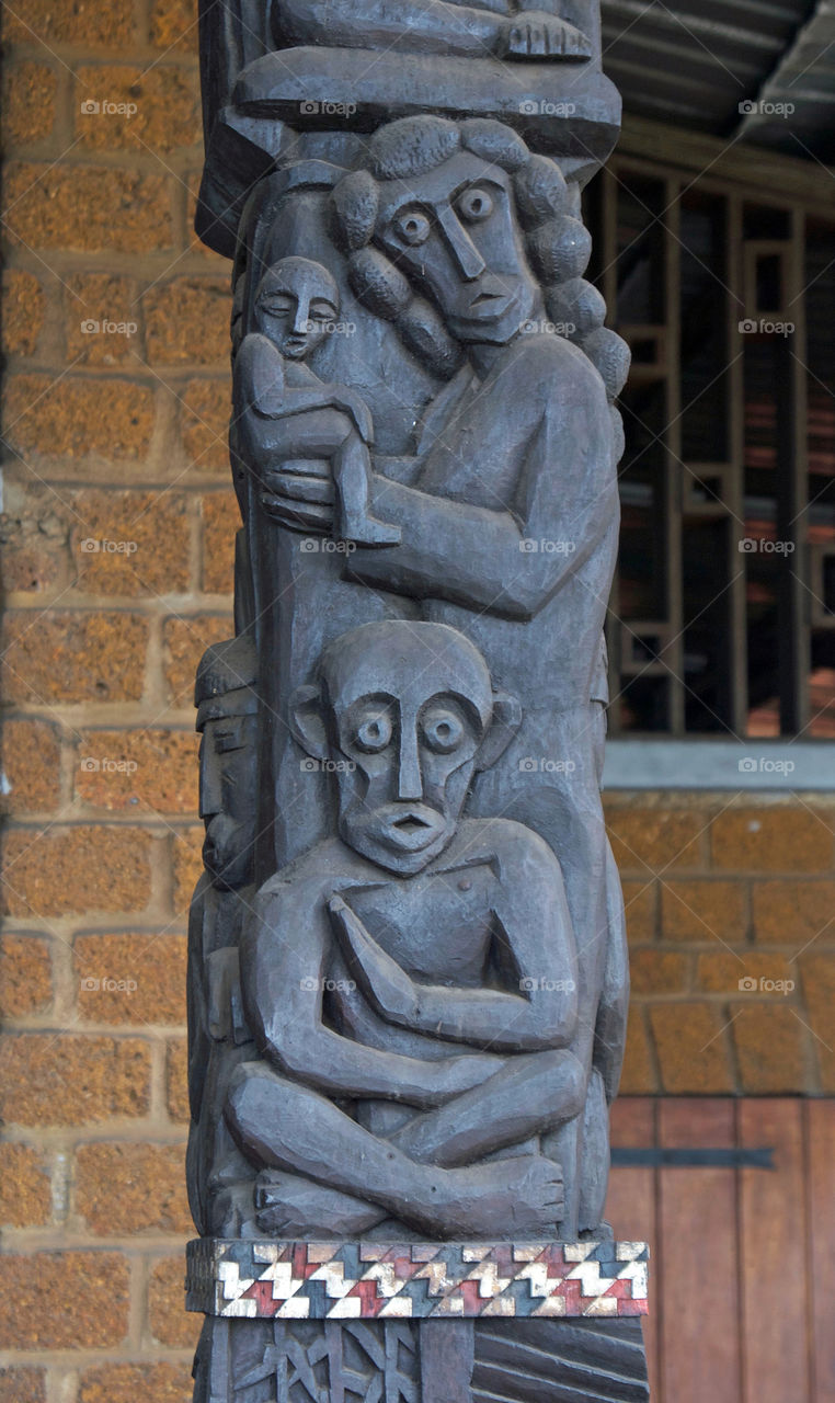 Carving on an entrance column at St Michel church, Libreville Gabon 