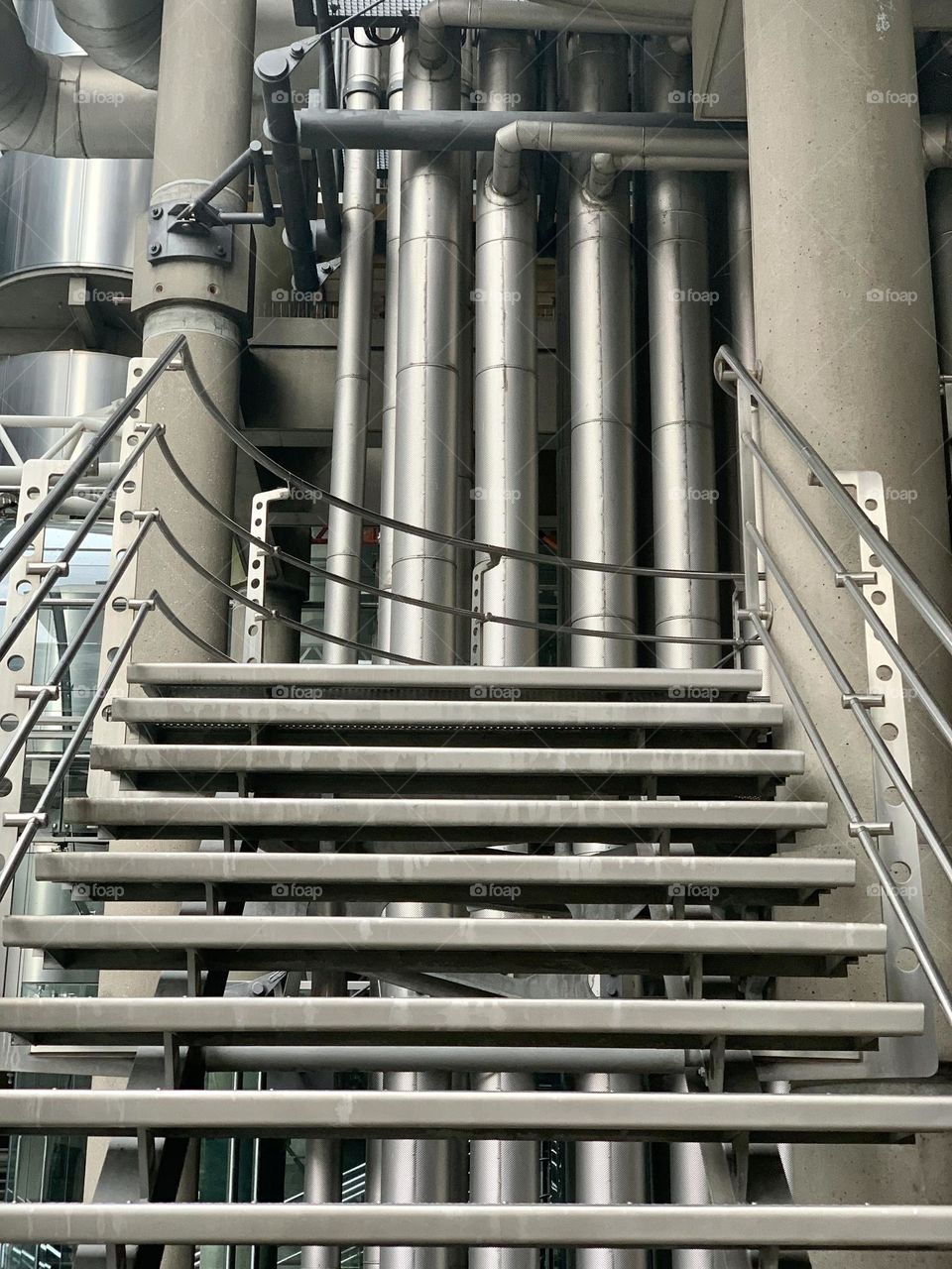 Metallic stairs and pipes in a skyscraper construction site 