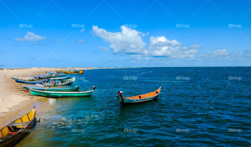 canoes waiting for the fishermen at the mouth of the Rio São Francisco
