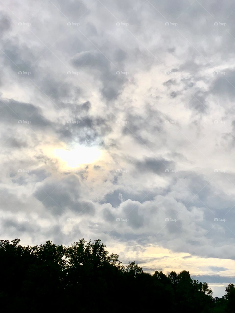 An eye of sun in the clouds