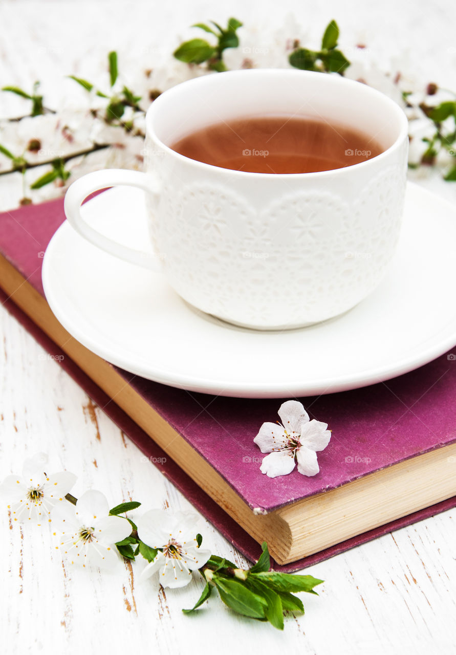 Cup of tea and spring blossom