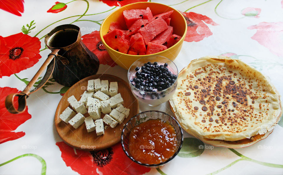 Homemade breakfast, pancakes, coffee, jam, watermelon, cheese..