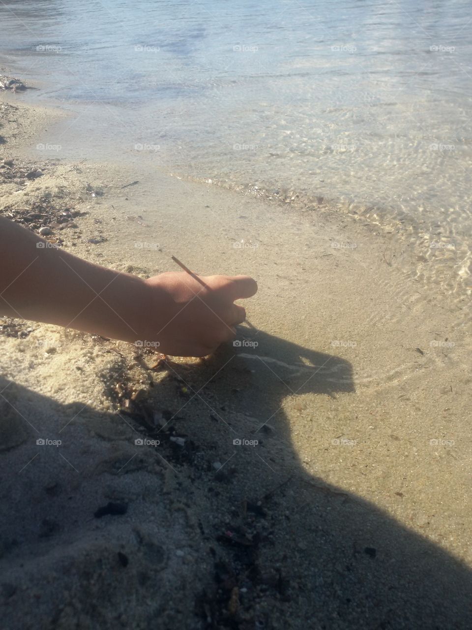 Drawing on the sand on beach