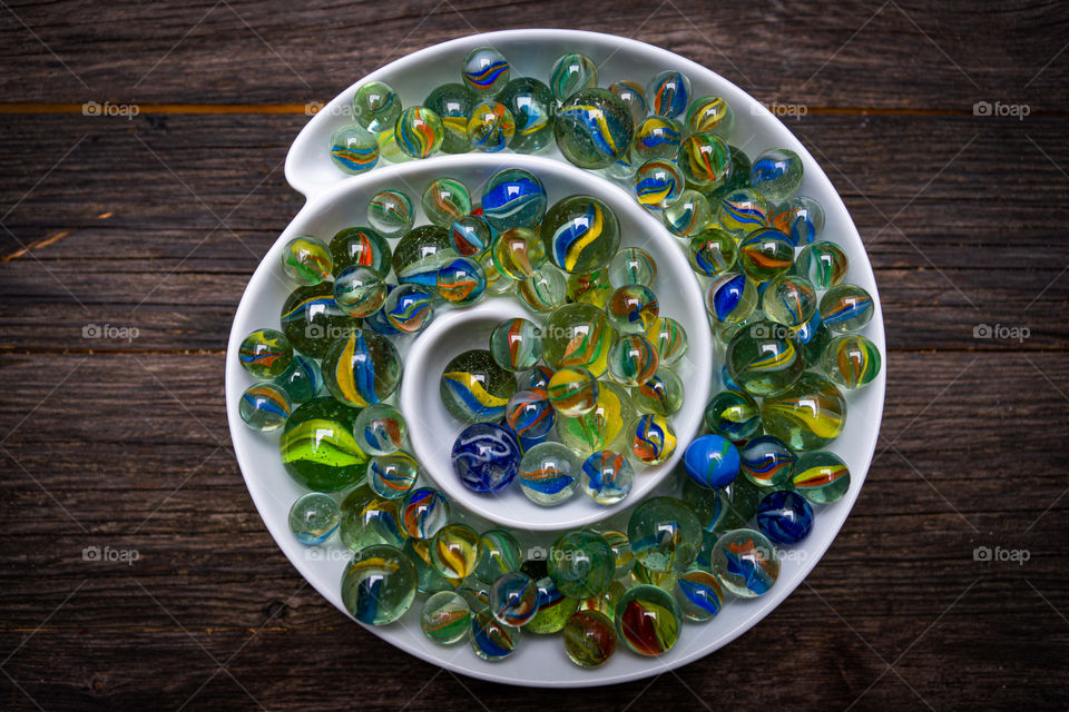 beautiful colored glass marbles in a bowl