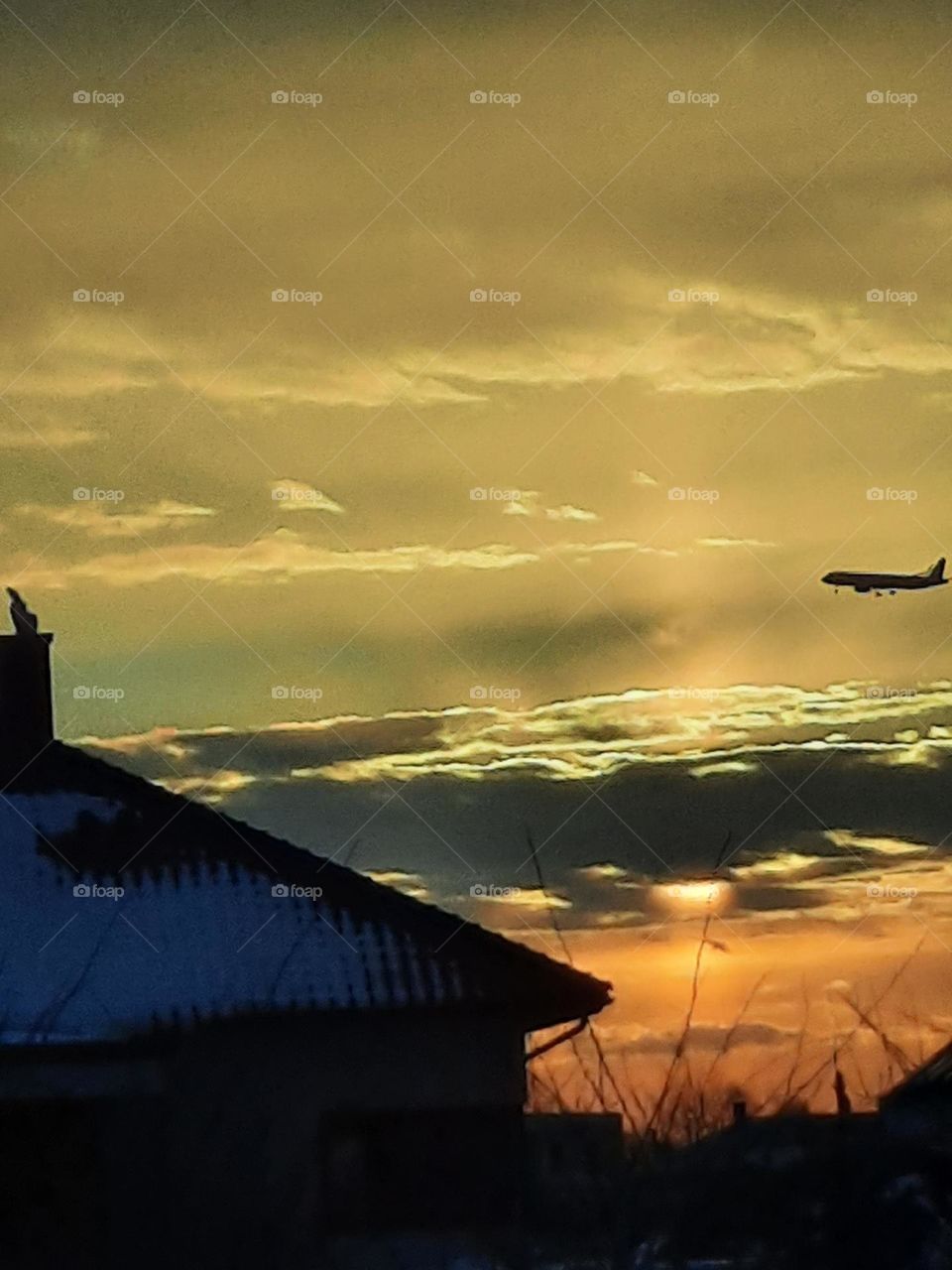 yellow sunrise with an aeroplane