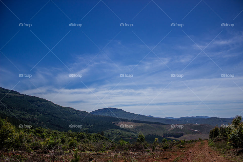 landscape with blue sky and mountain tops