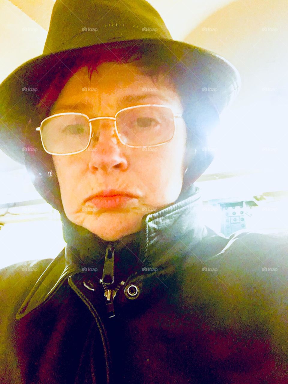Dressing like an Eskimo in the winter is the custom here in NYC. So here I am, „Petra Schiller“ in the „Van Alst Av 21st St“ „G“ train station all bundled up topped with black leather, a ski mask and a leather Fedora hat. 2020. Hypnotic Productions