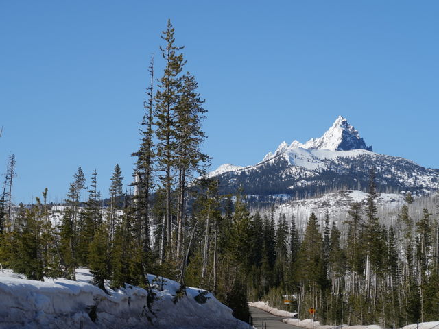 The magnificent snow covered Three Fingered Jack in Oregon’s Cascade Mountain Range against a clear blue sky on a beautiful spring day. 