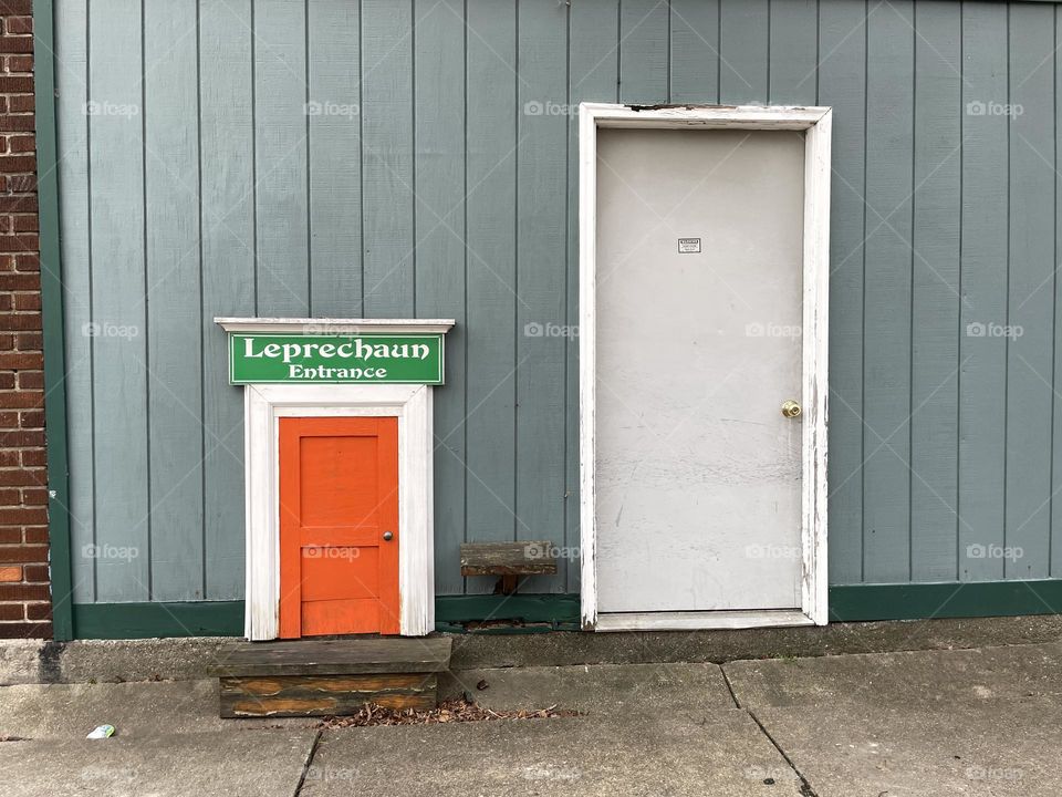 Tiny leprechaun orange door