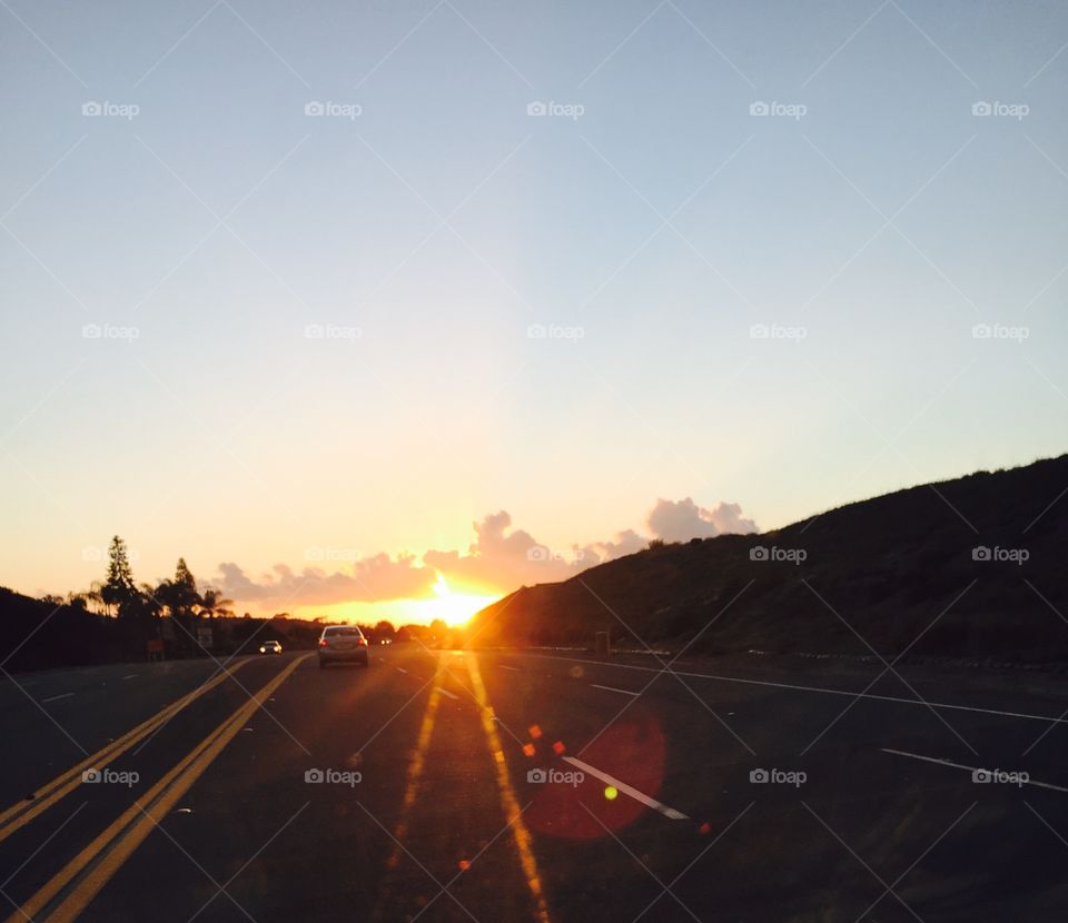 Sunset on the road. Caught the sun setting on my way home. 