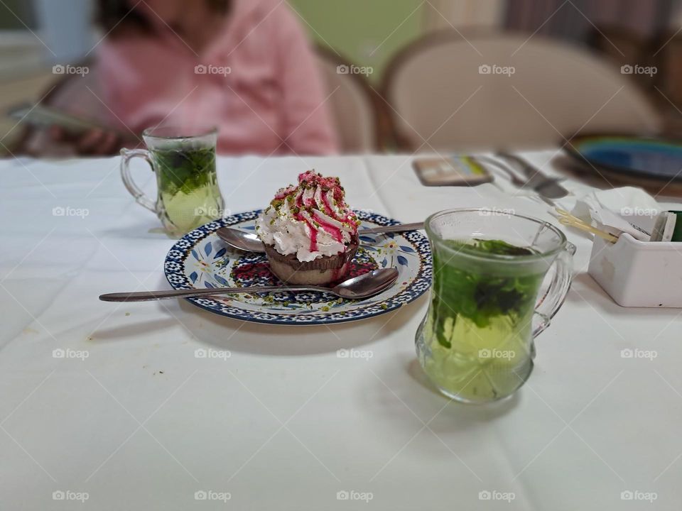 druse sweet desert with two cups of mint tea