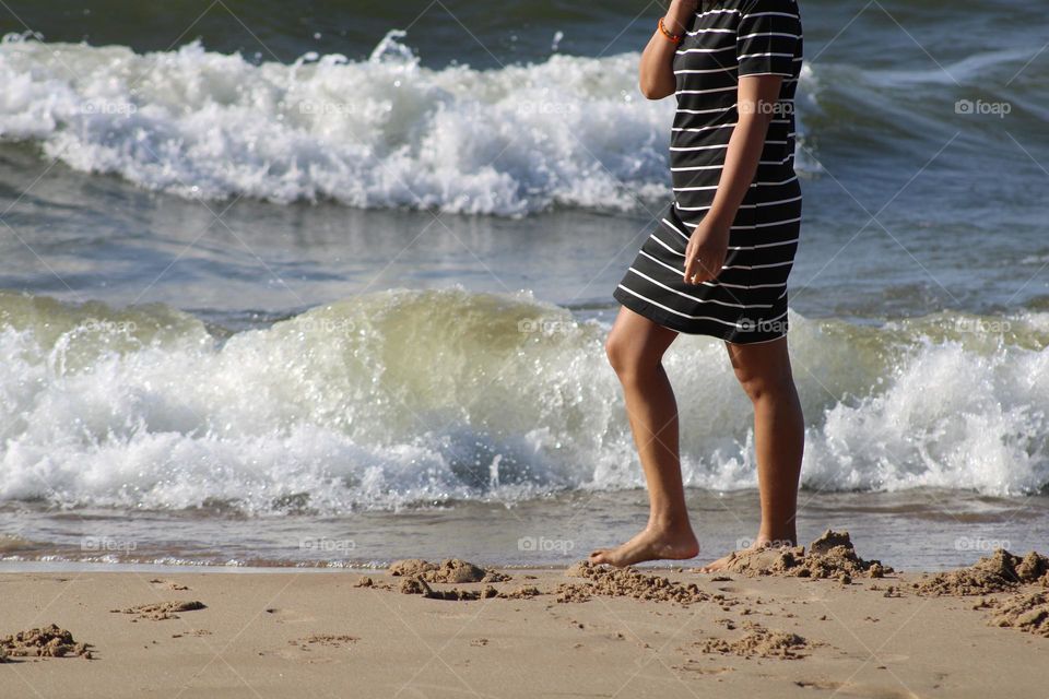 walking on the beach, just feeling the sand and the waves