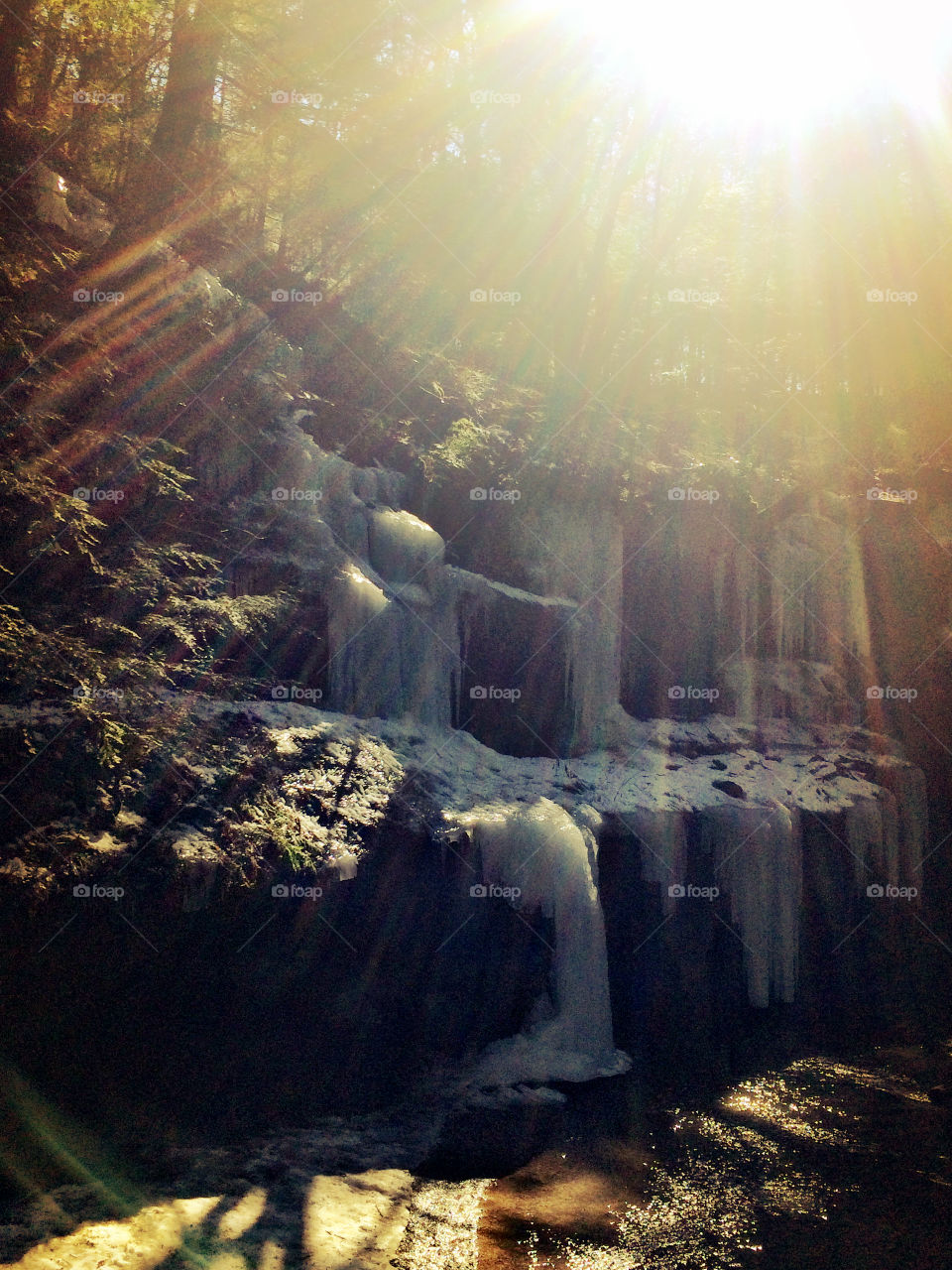 Sun rays in waterfall