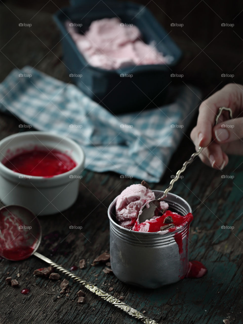 Homemade ice cream with berry sauce 