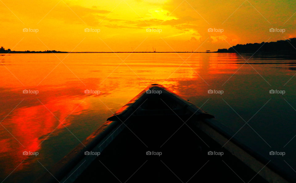 Canoe Sunset. This spectacular sunset was taken from the front of a canoe on Jolly Bay. This allowed me to enter this brilliant sunset