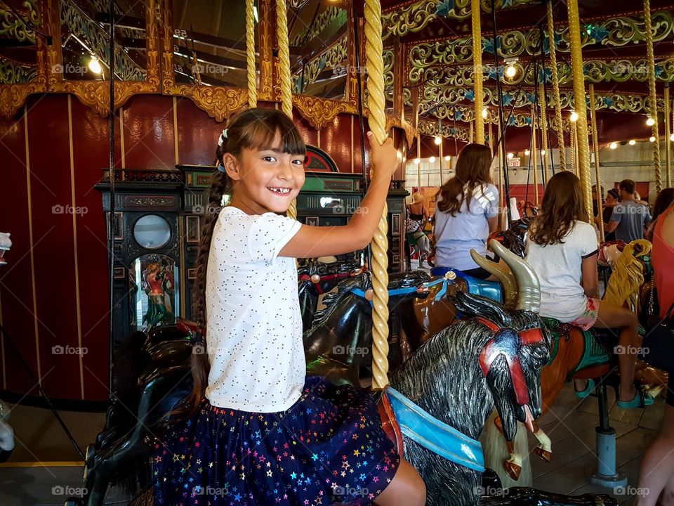 Taking a ride on a carousel