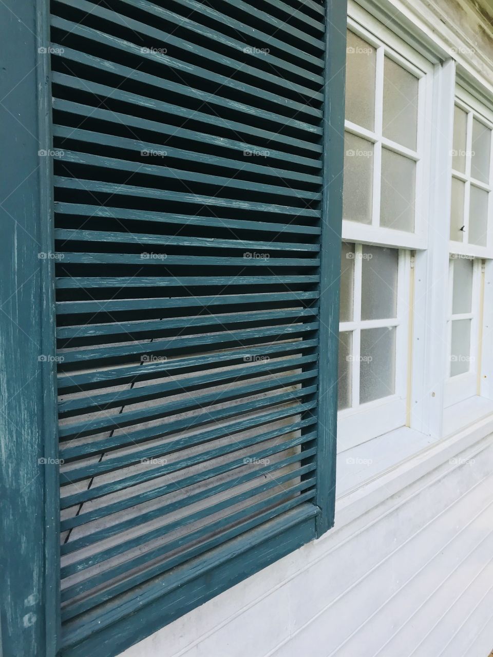Shutters at an old abandoned home