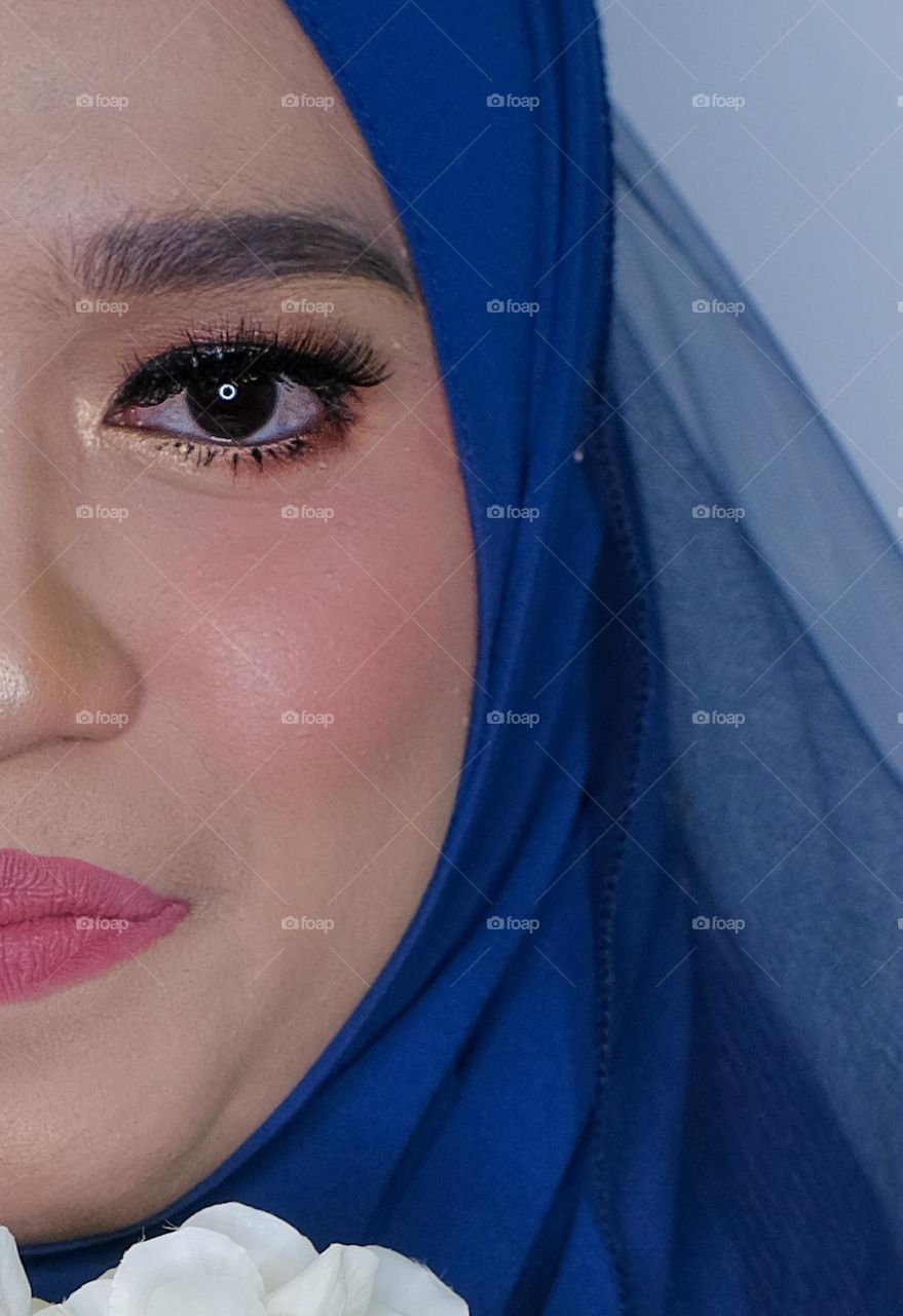 Beautiful bride eyes after make up session before wedding event started.