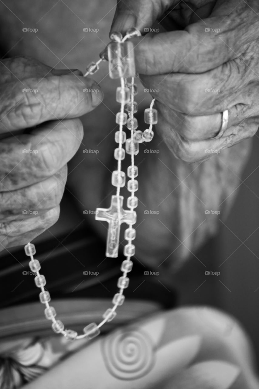 hands of old lady praying.
