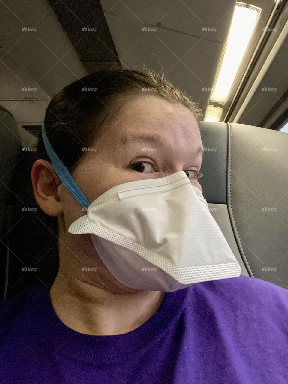 Wearing. Mask that looks like a ducks bill