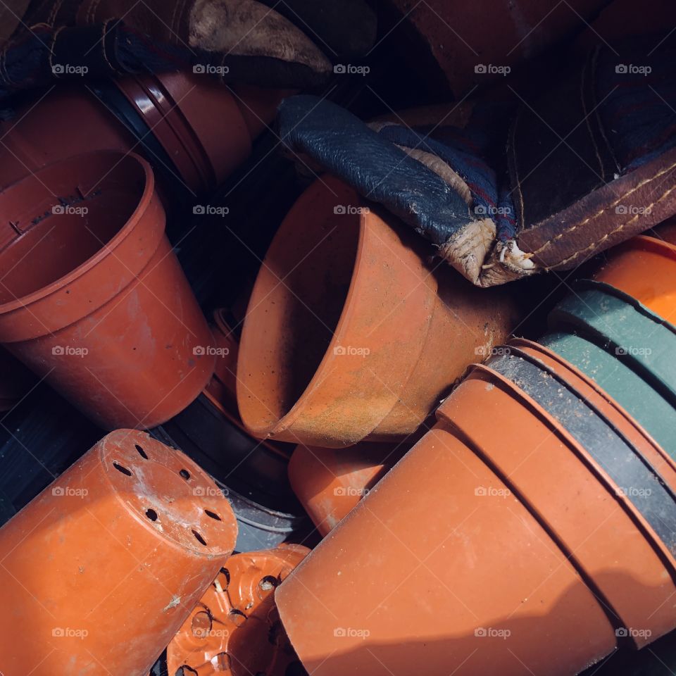 Mixture of ceramic and plastic terracotta plant pots 