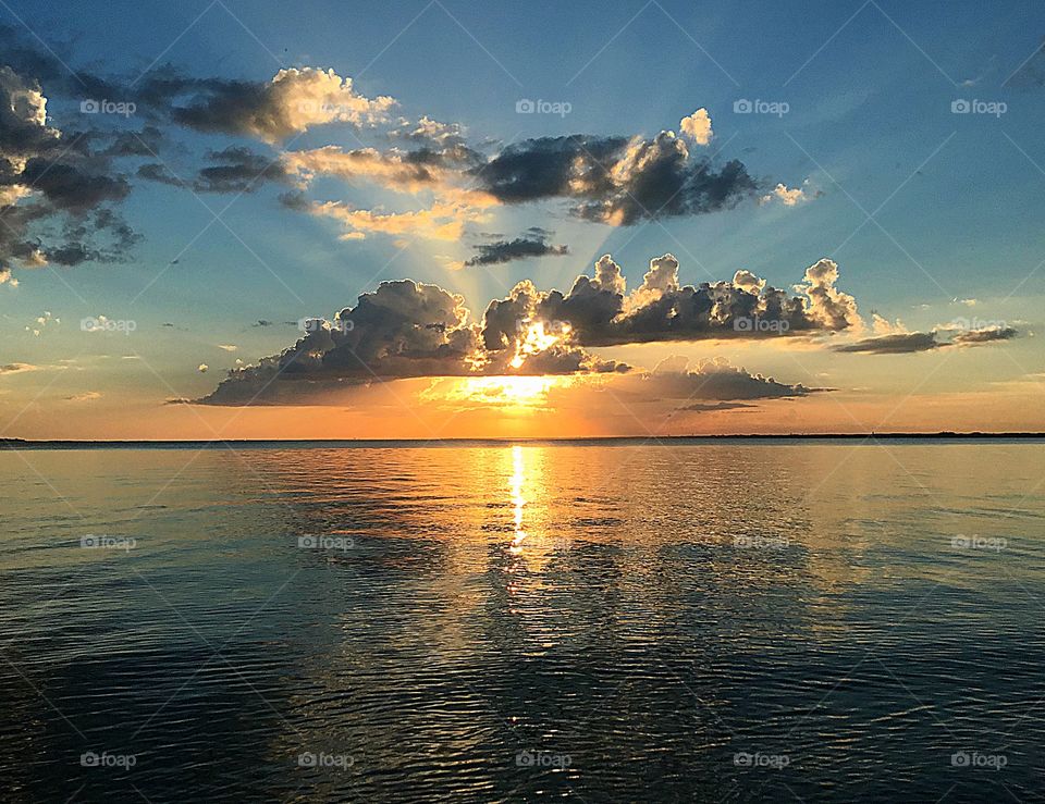 Sunset descending below the clouds