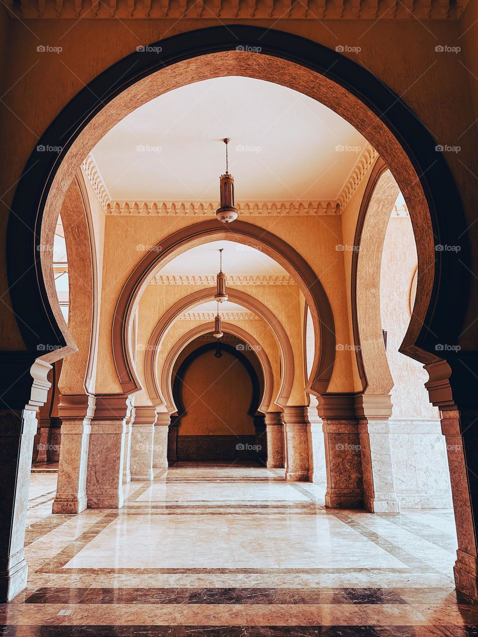 Arches and lanterns at a mosque 