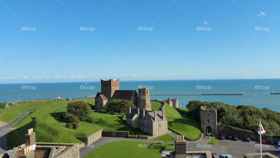 Dover castle. Dover medieval castle light house and church with sea view