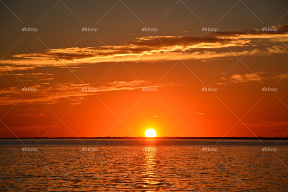 Sunsetting time - The dramatic hurried rush of orange collapse as the sun sank below the unfairly gorgeous hilly skyline looking like it had been planned by a sacred conspiracy of divinities