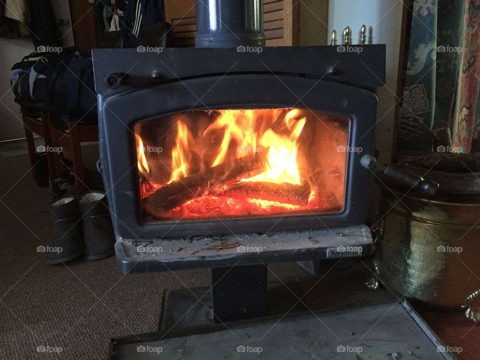 Fireplace with roaring fire