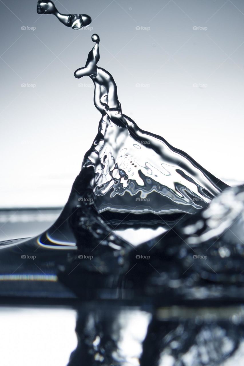 Blue Water Splash Abstract Art Background. Toned . Close up