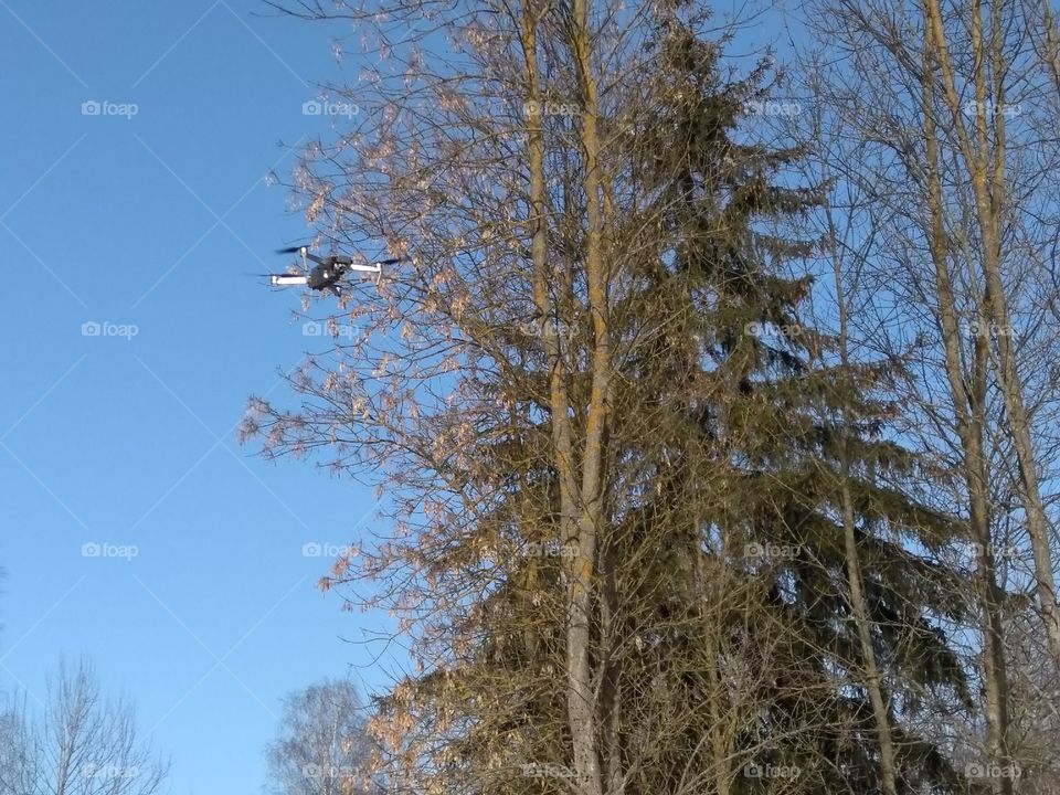 quadcopter landscape in the solar park blue sky background