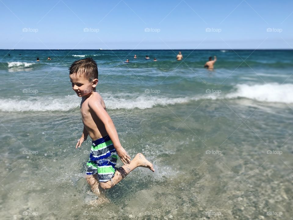 Boy running on the beach