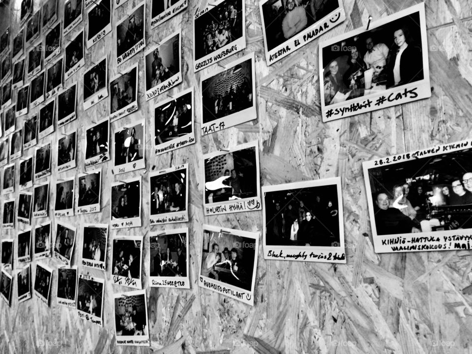 Polaroid photos on a wall 