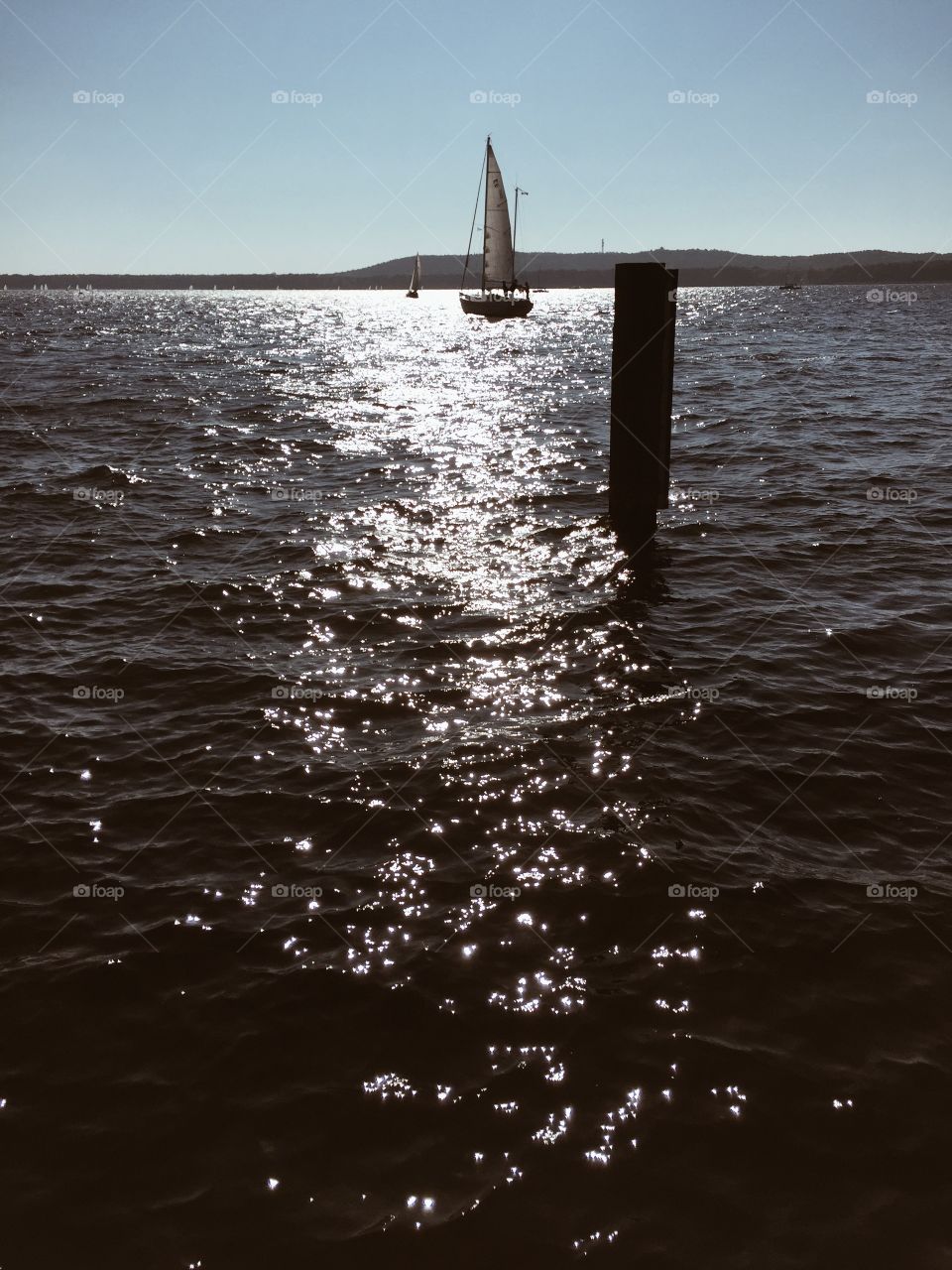 Boat on lake, sunny weather. Sailing boat on lake in sunny autumn weather