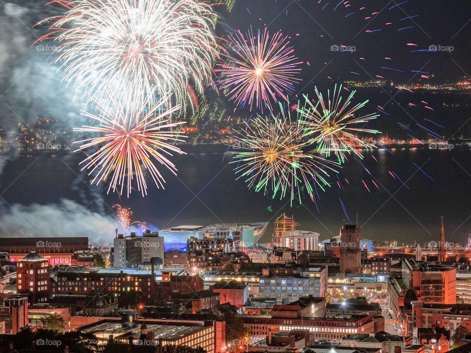 fireworks explode over a vibrant Dundee cityscape for the opening of the new V&A museum