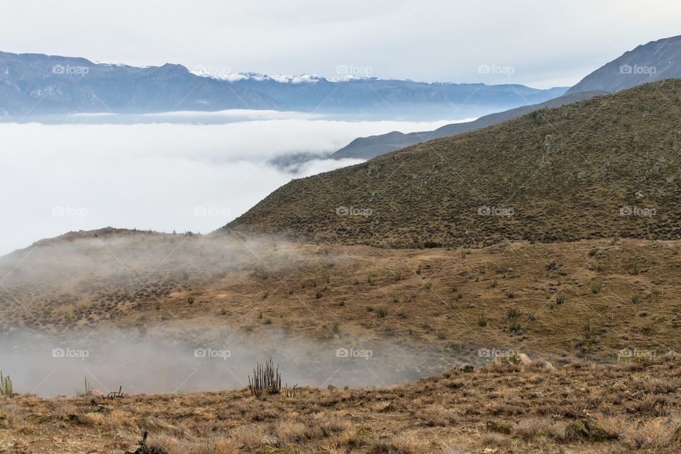 Mountain in the andes with cloudy skies