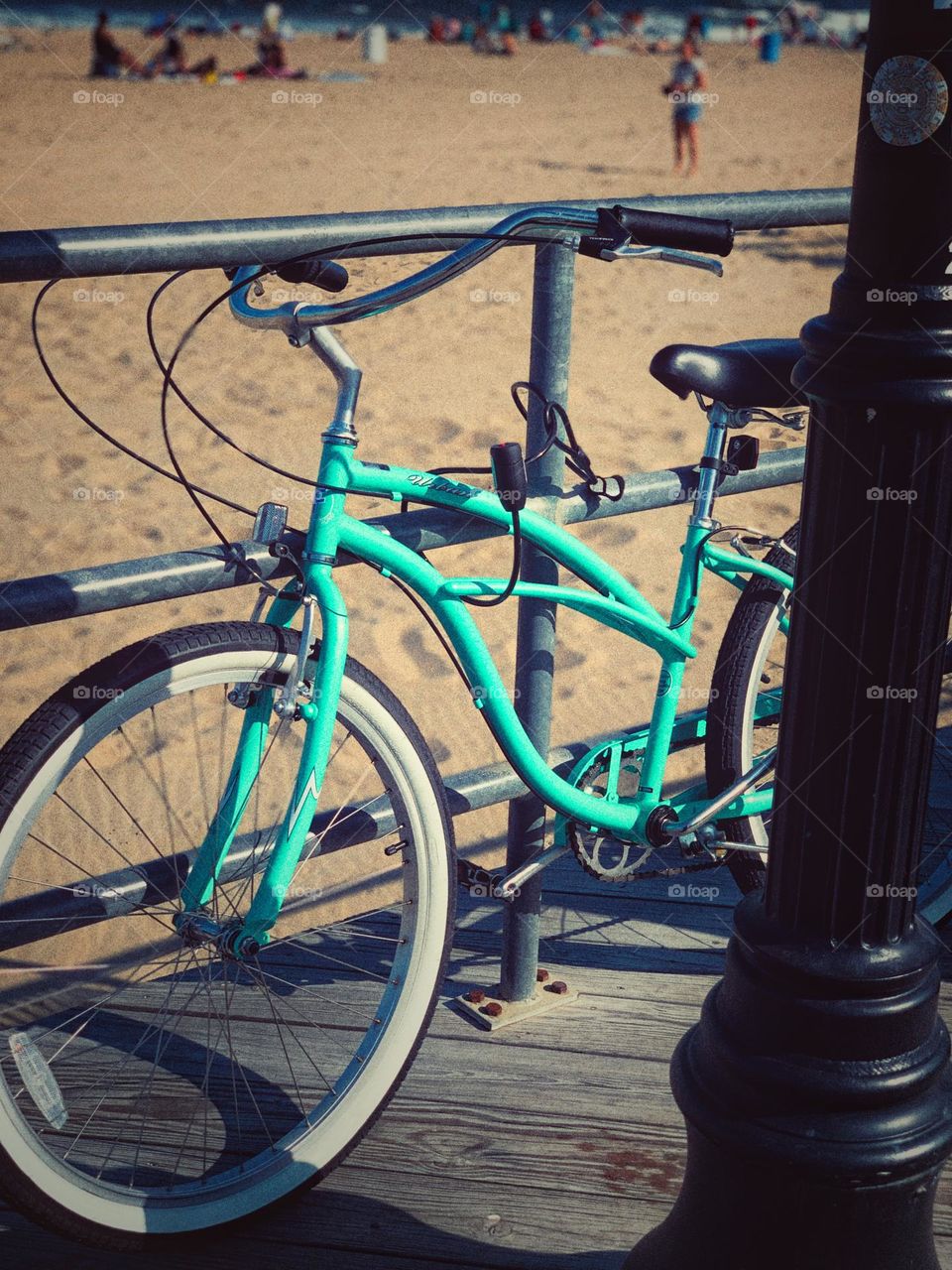 Green bike on the boardwalk