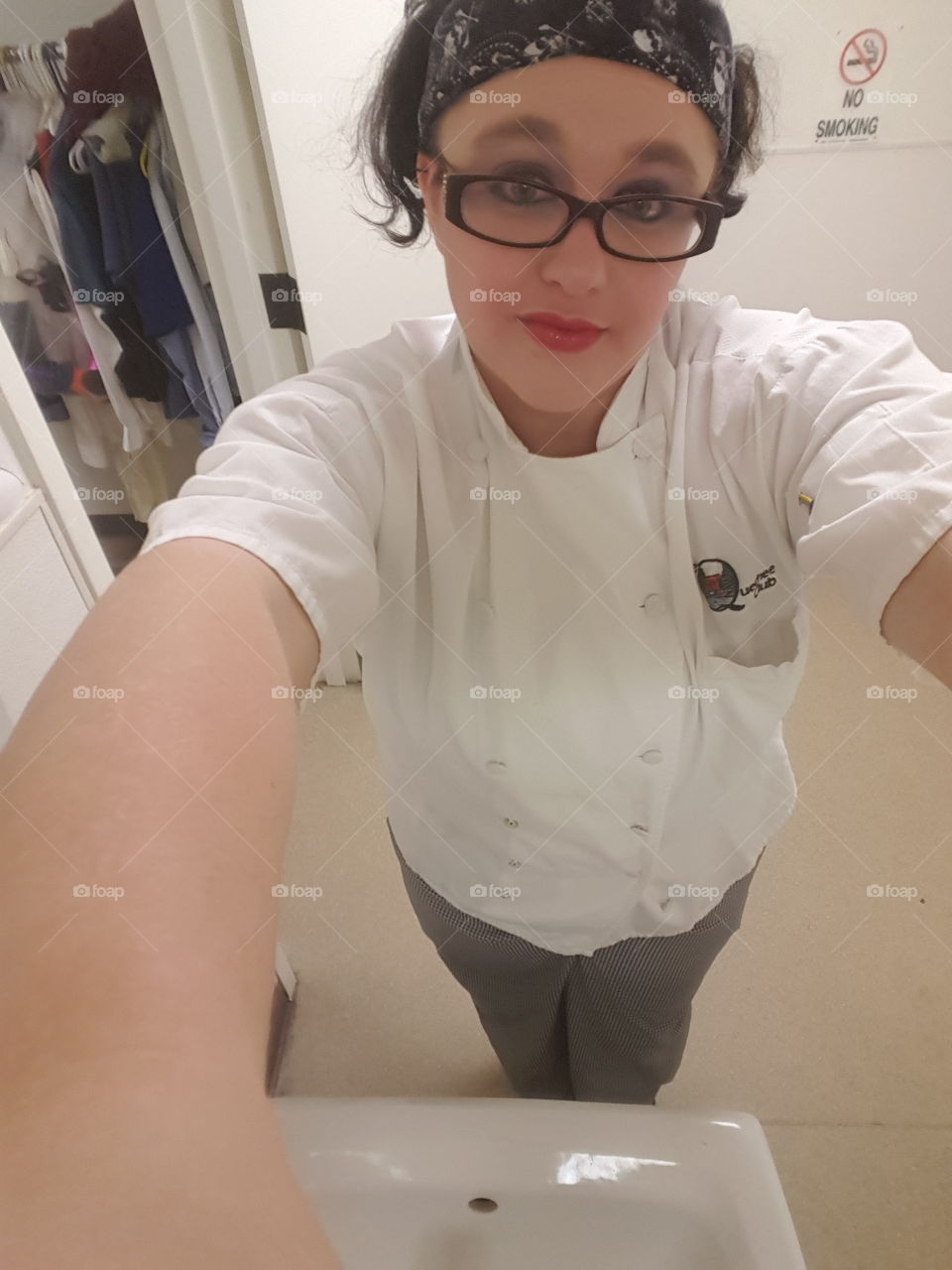 working girl selfie with makeup, glasses, pigtails, and chef jacket