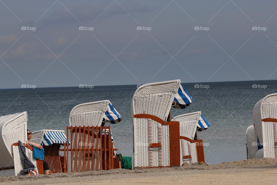sunbathing in a beach chair