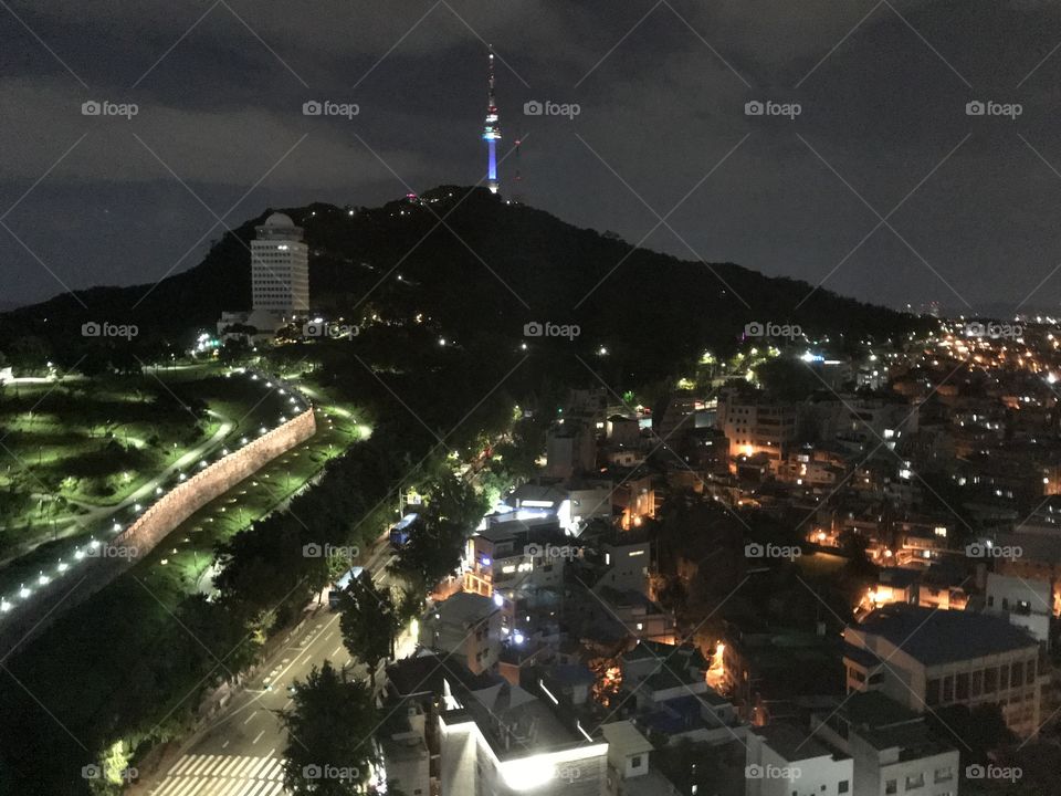 A night snap of Seoul in an August summer evening, with the TV tower lit up in the distance 