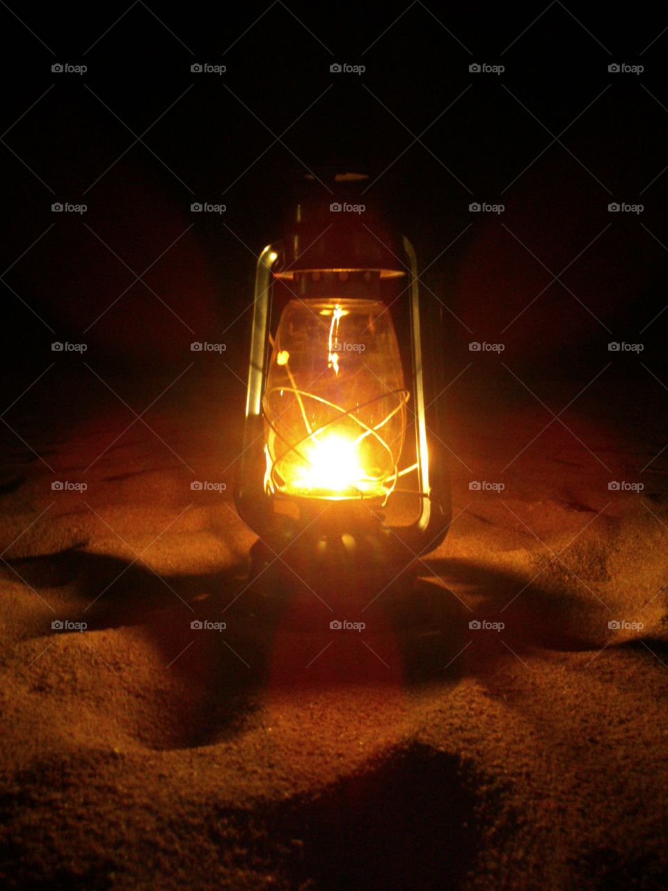 Yellow Lantern.  Traditional oil lamp lit in beach by the hotel crew at Malu Malu Resort Pasikuda to please the surrounding