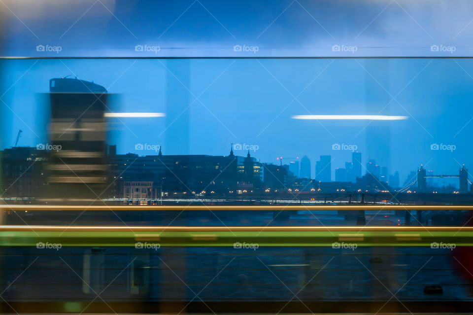 Cityscape at night from train window. London. UK.