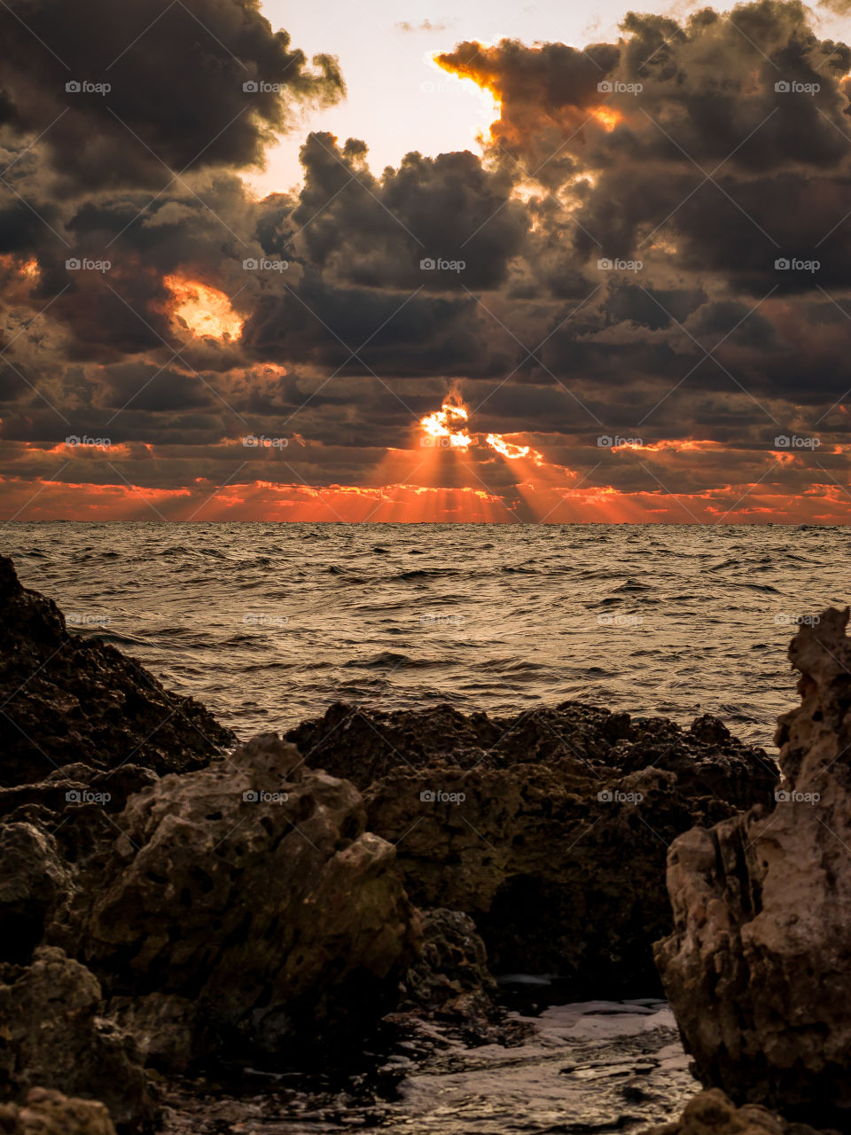 Autumn evening on the Black Sea.  On the horizon through the clouds, the rays of the sun break through