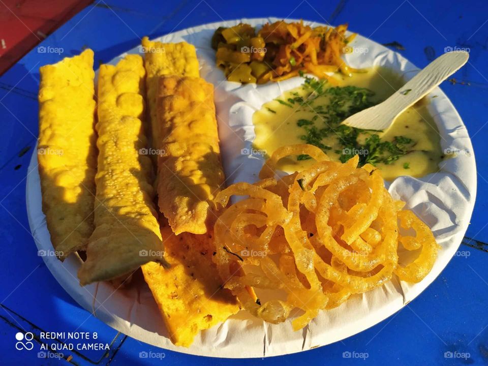Fafda jalebi : Fafda, is a popular Gujarati snack. In many festivals, fafda is the most preferred snack. Fafda is rectangular in shape and yellowish in complexion.
Jalebi, also known as jilapi, jilipi, zulbia, mushabak and zalabia, is a Indian sweet